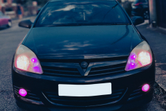 Vauxhall Astra with purple lights